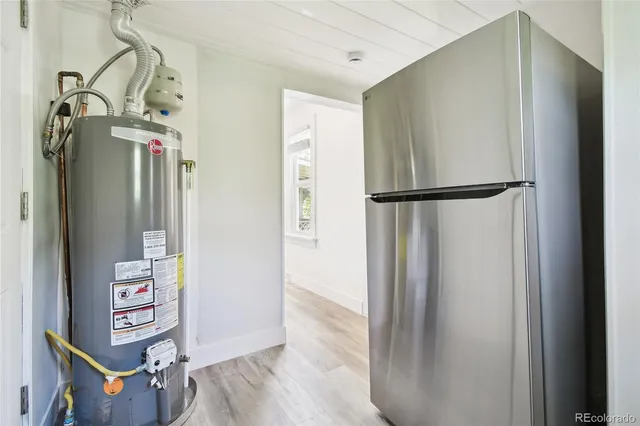 a view of a closet with wooden floor
