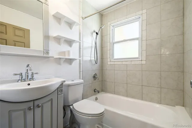a bathroom with a toilet and a bathtub