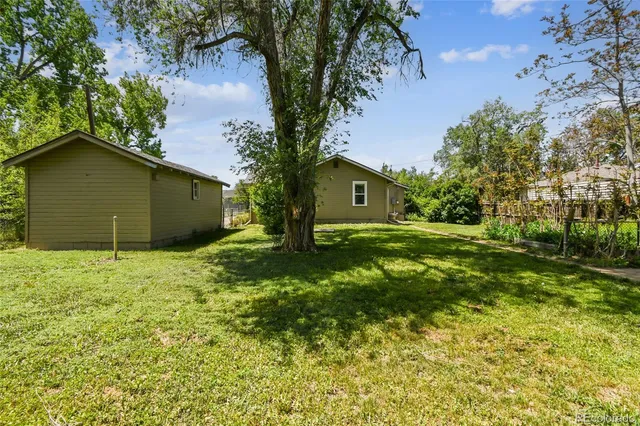 a backyard of a house with lots of green space