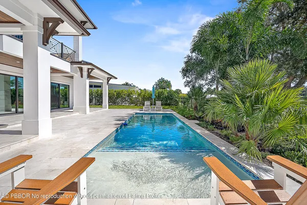 a view of a backyard both side of the house