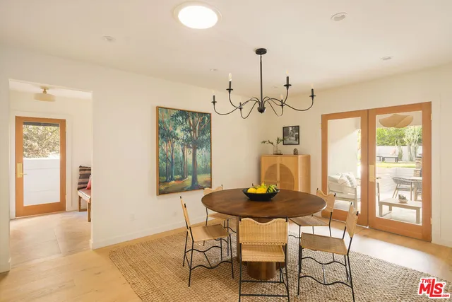 a view of a room that has a bed and a window in it