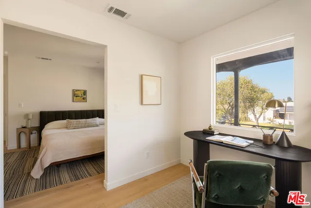 a workspace with furniture and window