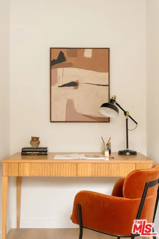 a bathroom with a toilet sink and a mirror