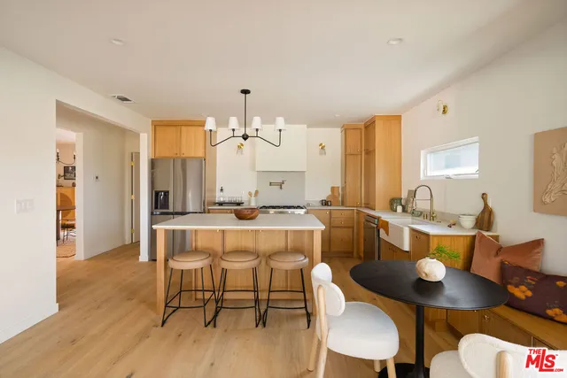 a kitchen with a table and chairs