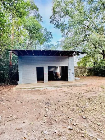 a house with trees in the background
