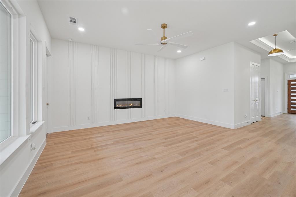 1147 Riverwood Road Dallas, TX 75217 - Photo 11 of 26 a view of an empty room with a chandelier