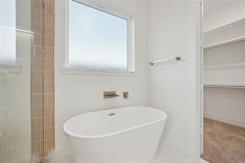 1147 Riverwood Road Dallas, TX 75217 - Photo 18 of 26 a white bath tub sitting next to a white sink