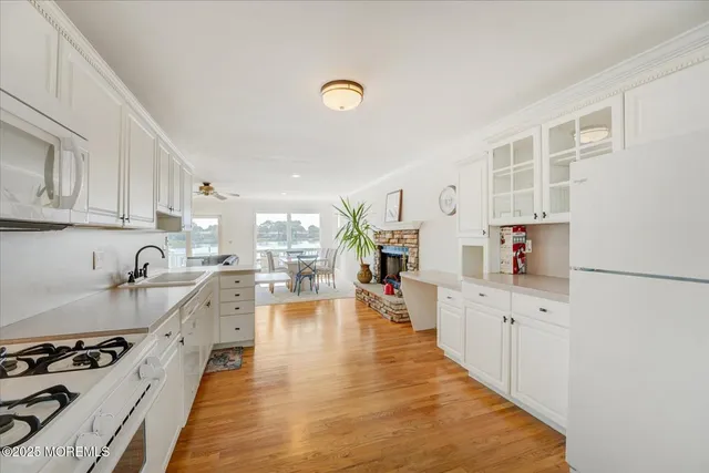 a kitchen with a sink stove and microwave