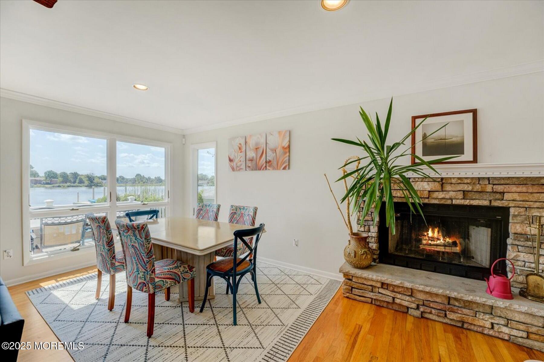 74 Seneca Place Oceanport, NJ 07757 - Photo 15 of 45 a dining room with furniture a fireplace and a floor to ceiling window