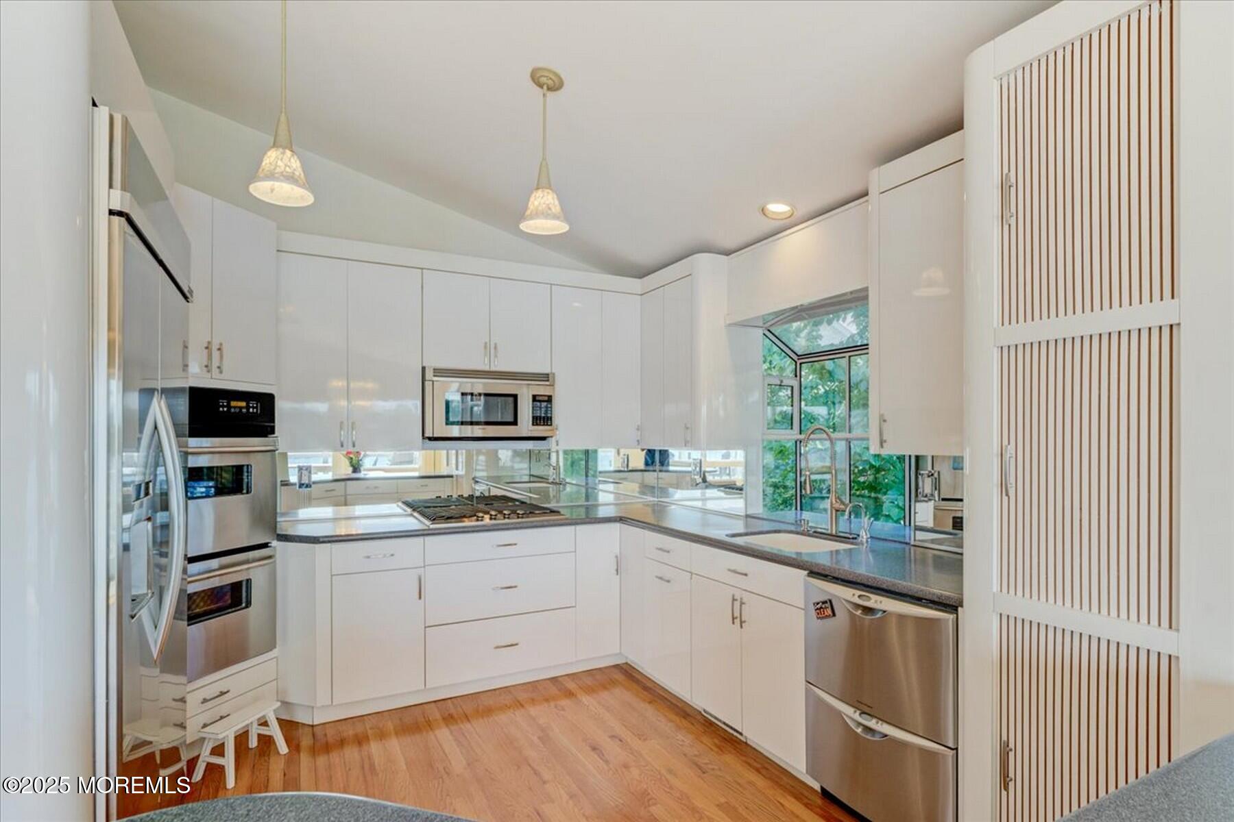 74 Seneca Place Oceanport, NJ 07757 - Photo 24 of 45 a kitchen with a sink stove and microwave