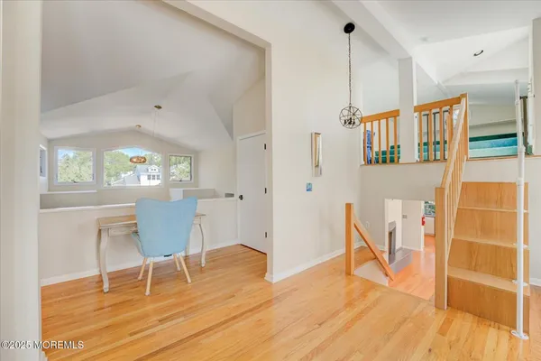 a view of dining room with furniture and wooden floor