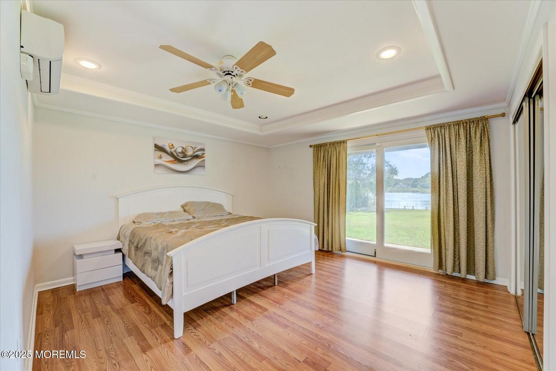 74 Seneca Place Oceanport, NJ 07757 - Photo 32 of 45 a bedroom with a bed and large window