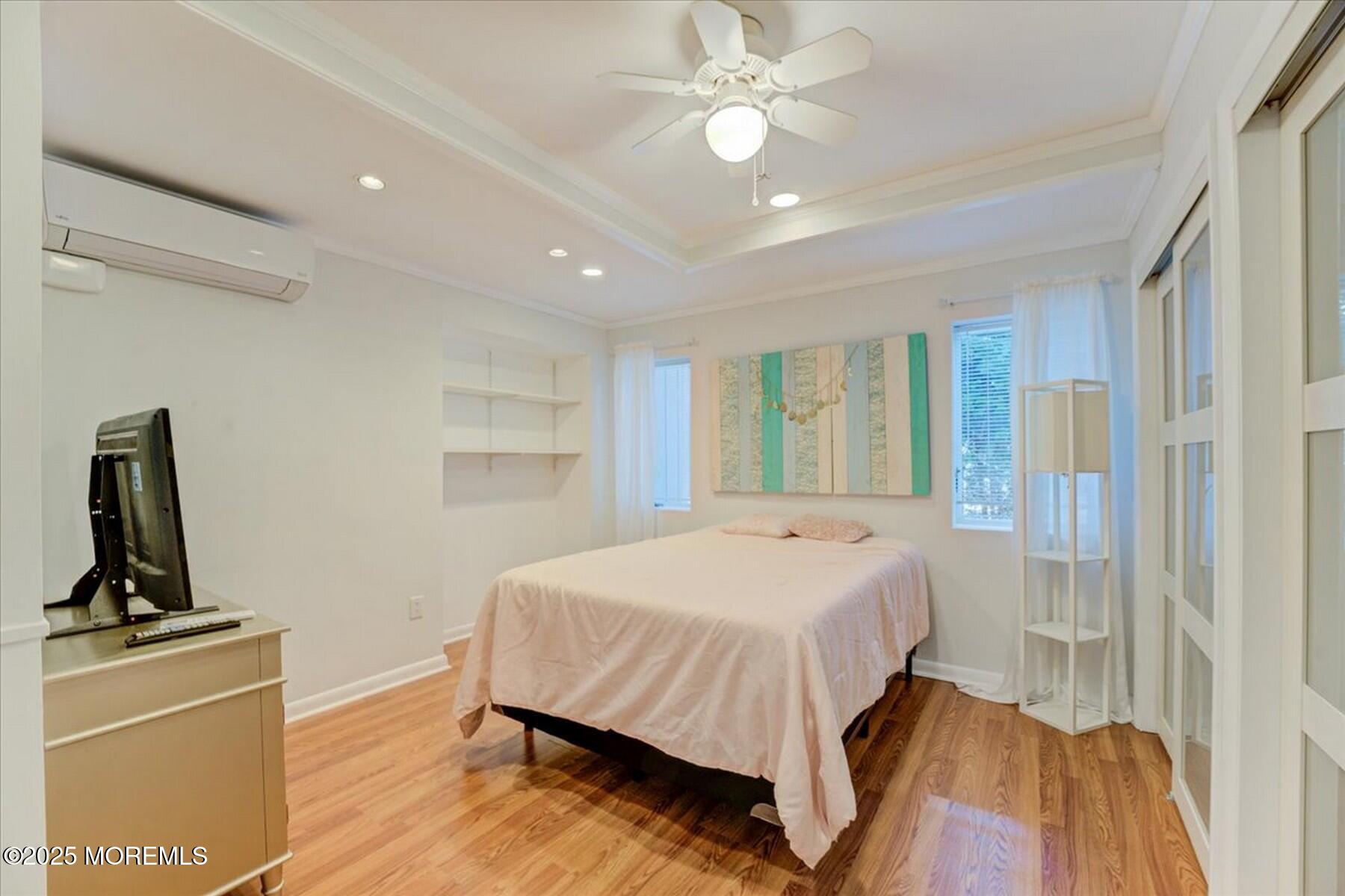 74 Seneca Place Oceanport, NJ 07757 - Photo 33 of 45 a bedroom with a bed and a flat screen tv