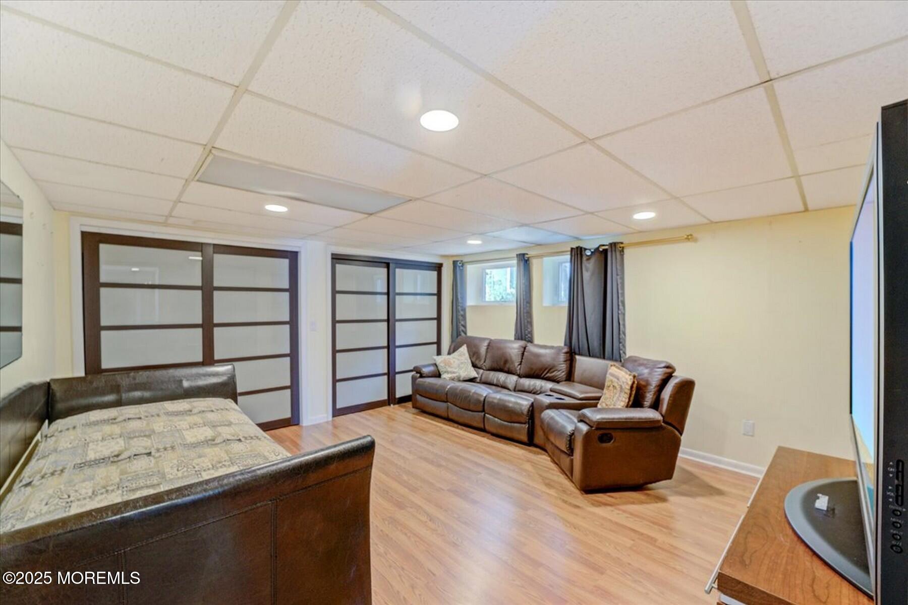74 Seneca Place Oceanport, NJ 07757 - Photo 34 of 45 a living room with furniture and a wooden floor