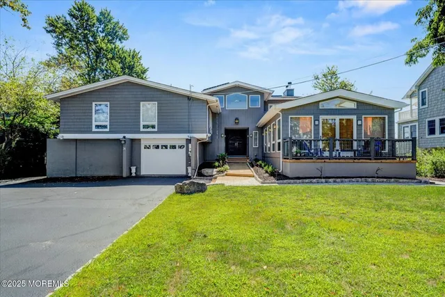 a dining room with furniture a fireplace and a floor to ceiling window