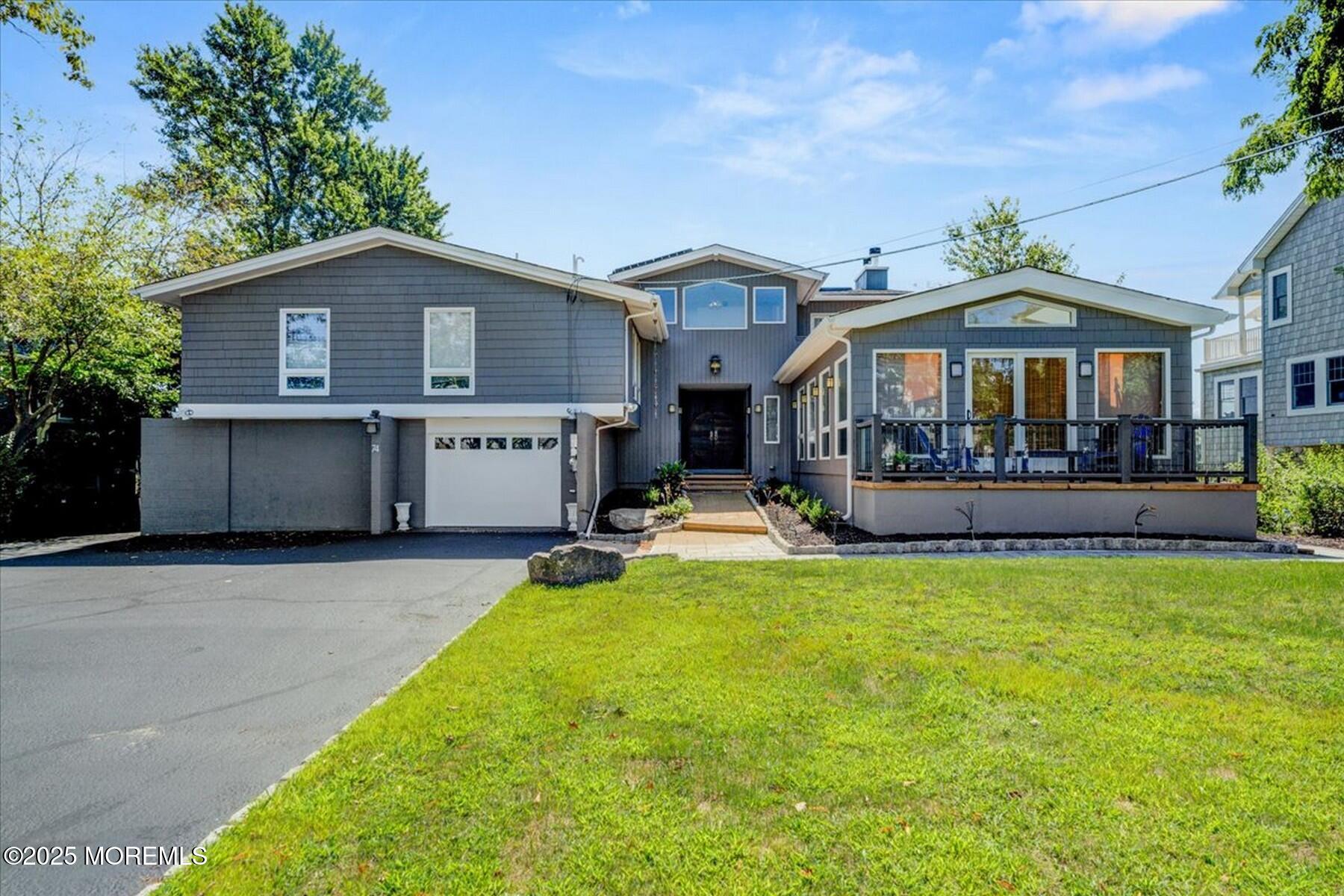 74 Seneca Place Oceanport, NJ 07757 - Photo 6 of 45 a front view of a house with swimming pool