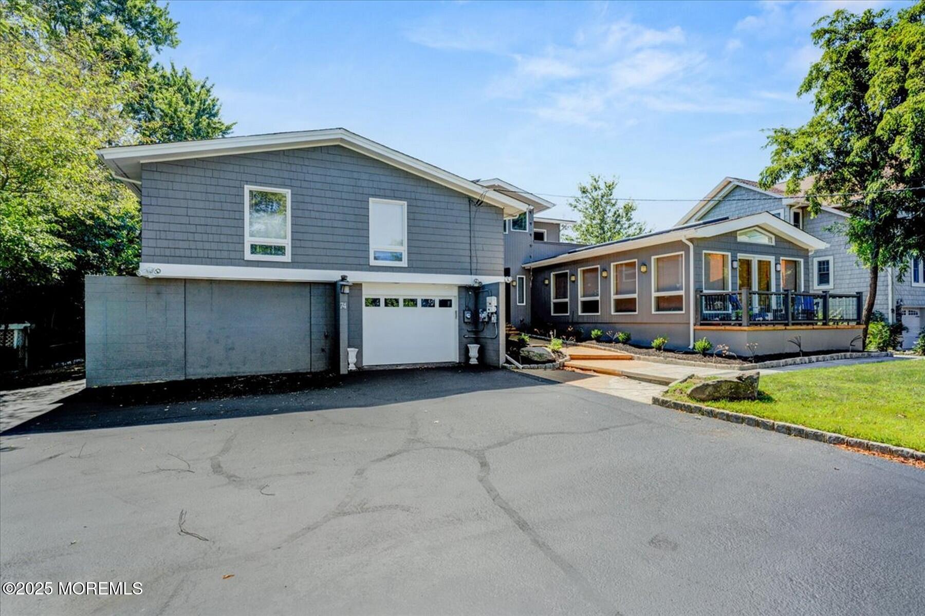 74 Seneca Place Oceanport, NJ 07757 - Photo 7 of 45 a view of a house with a yard and tree s