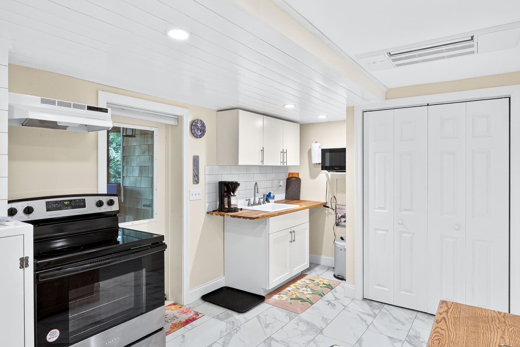 11 Whelpley Road Eastham, MA 02642 - Photo 25 of 43 a kitchen with stainless steel appliances a stove a refrigerator and a cabinets