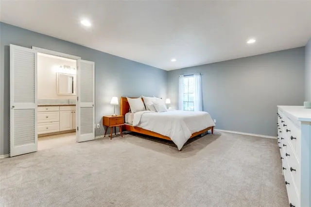 a bedroom with a bed and a cabinets