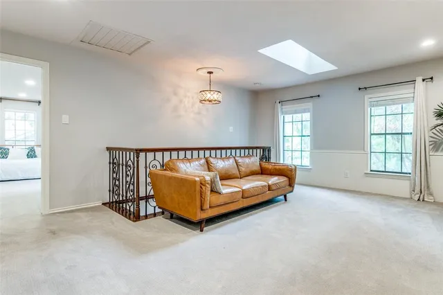 a spacious bedroom with a bed and a couch