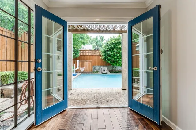 a view of a glass door and wooden floor