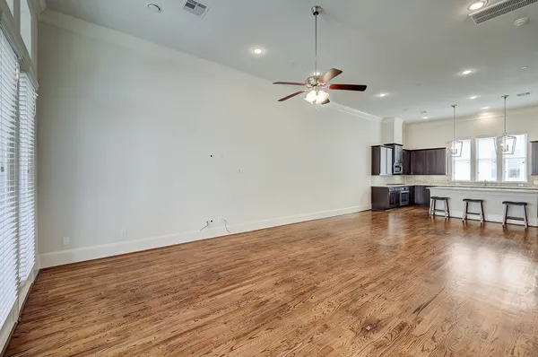 a view of a kitchen with a dishwasher cabinets and wooden floor