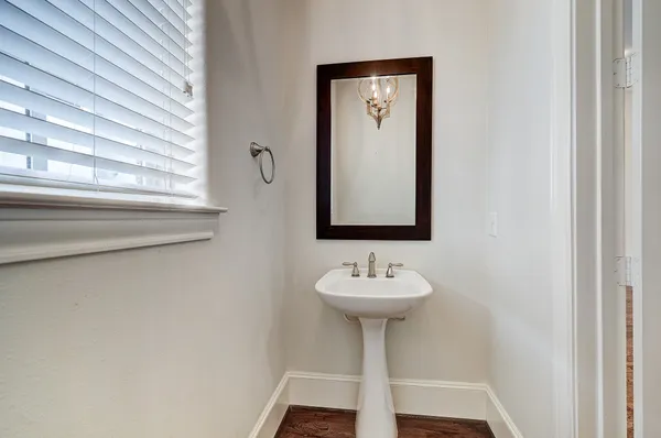a bathroom with a sink and mirror