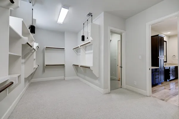 an empty room with a empty space and windows