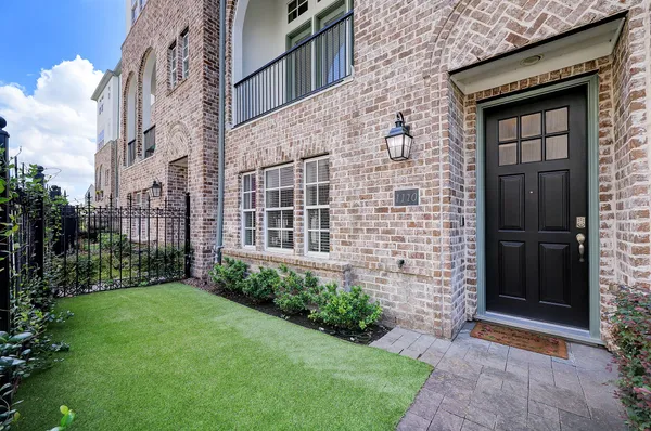 a brick building with a yard