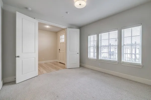 a view of an empty room with a window