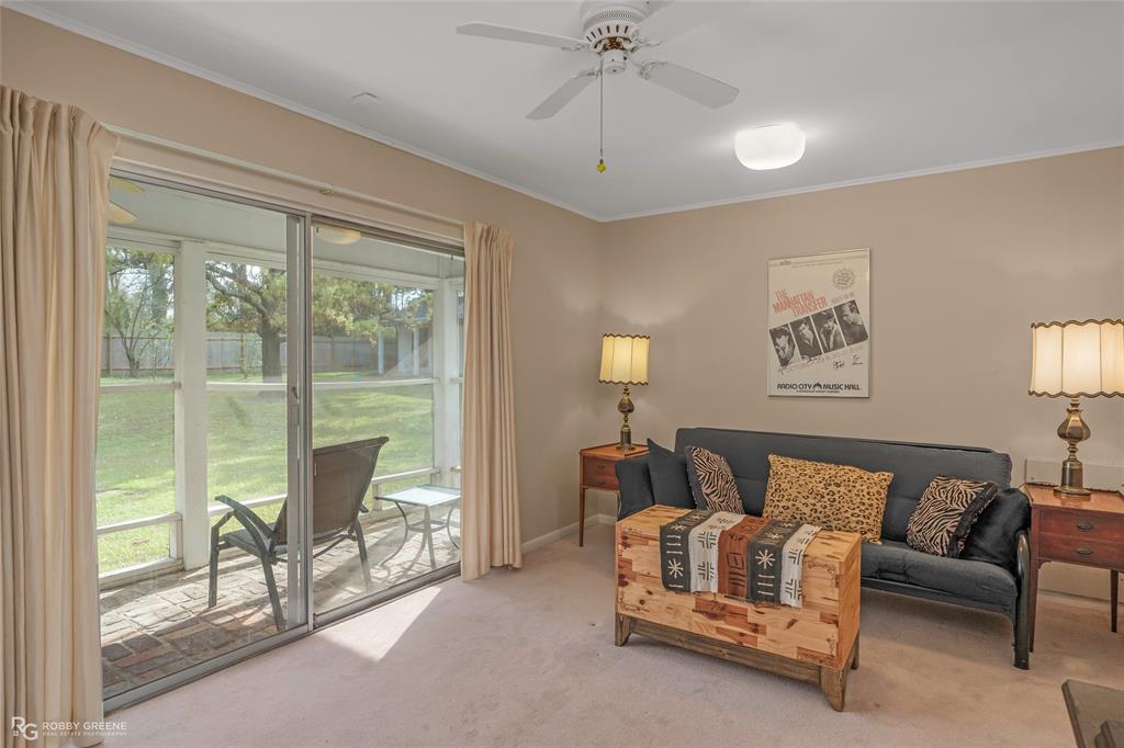 701 Palmetto Road Benton, LA 71006 - Photo 11 of 28 a spacious bedroom with a bed and glass window