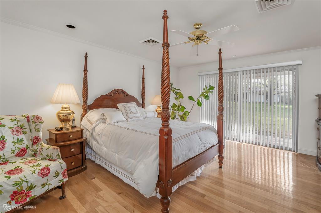 701 Palmetto Road Benton, LA 71006 - Photo 13 of 28 a bedroom with a bed and a window