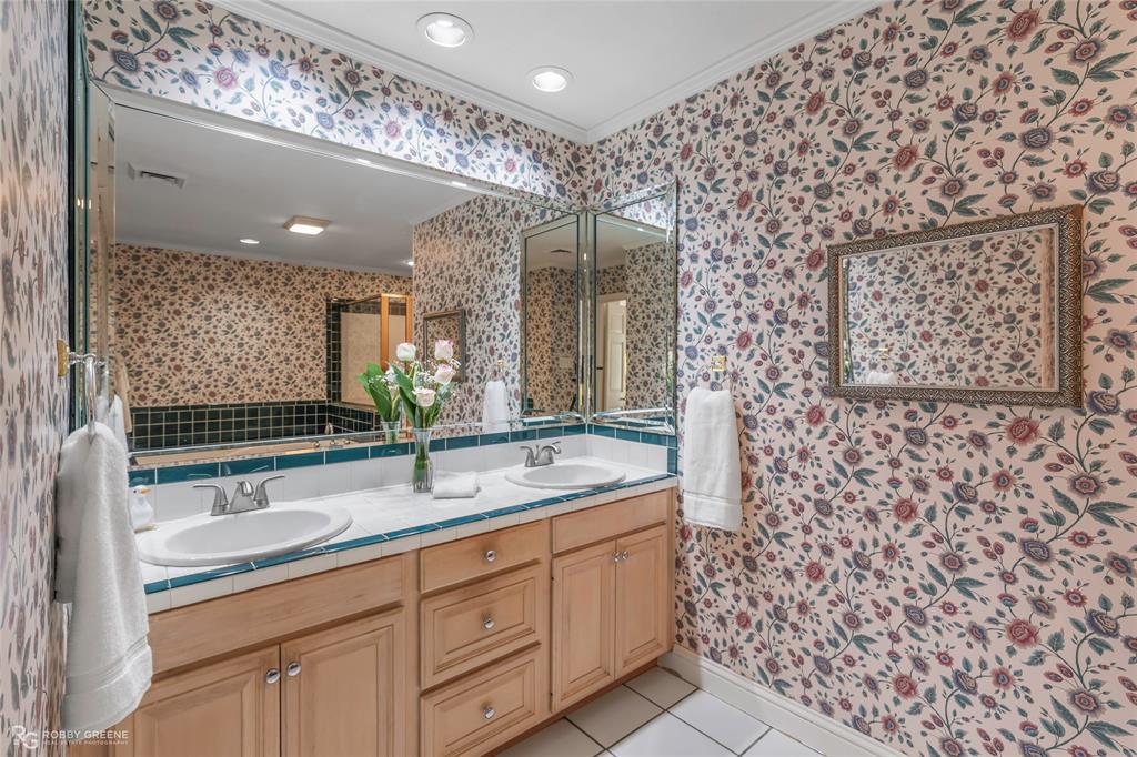 701 Palmetto Road Benton, LA 71006 - Photo 14 of 28 a bathroom with a double vanity sink mirror and shower