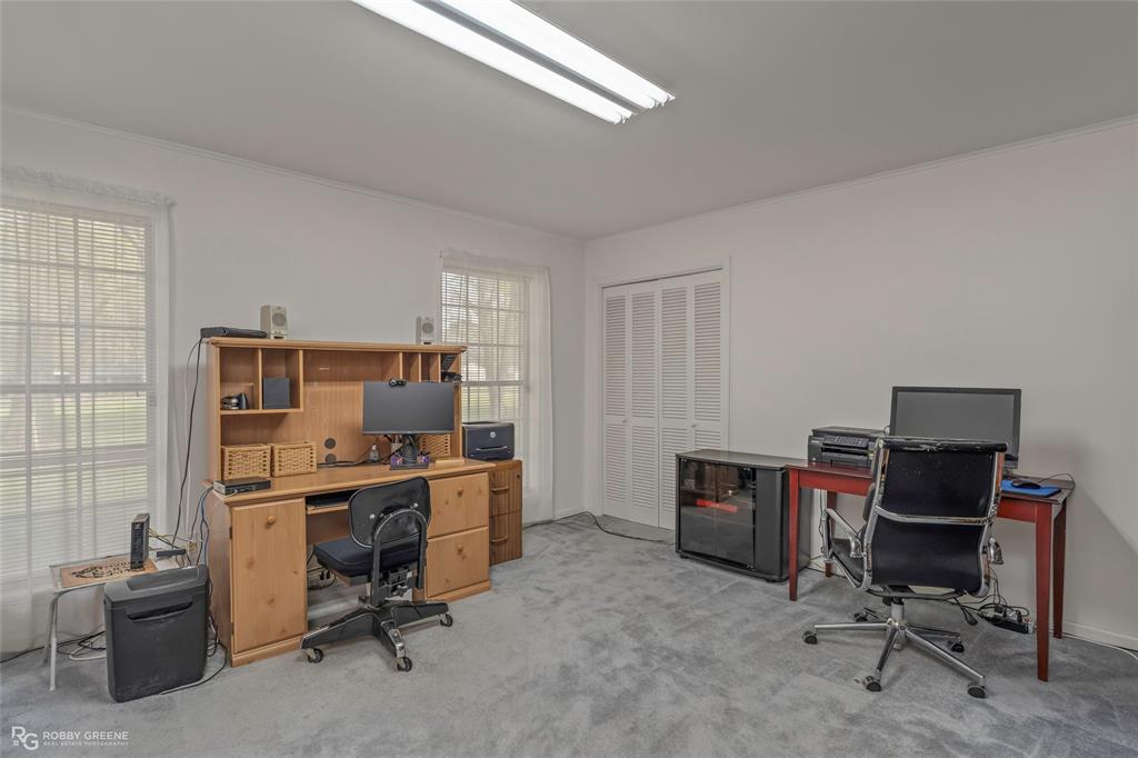 701 Palmetto Road Benton, LA 71006 - Photo 20 of 28 a view of a workspace with furniture and a window