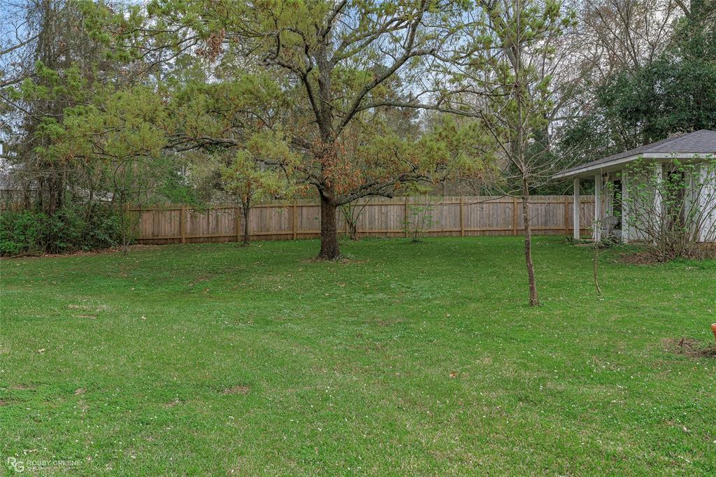 701 Palmetto Road Benton, LA 71006 - Photo 2 of 28 a view of a yard with a house