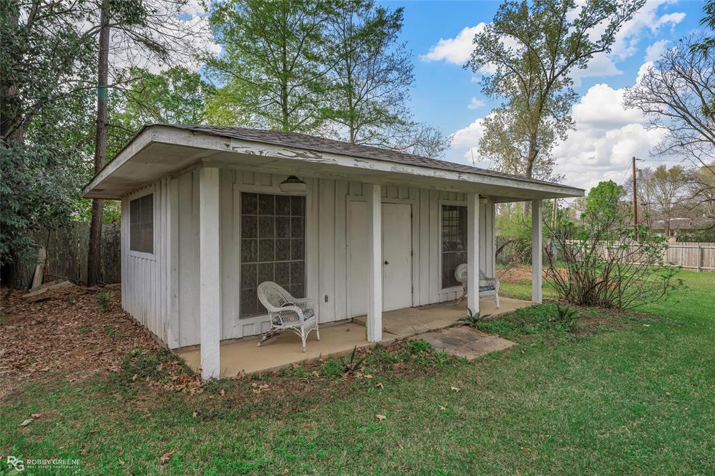701 Palmetto Road Benton, LA 71006 - Photo 21 of 28 a house view with a garden space