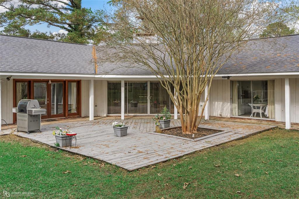 701 Palmetto Road Benton, LA 71006 - Photo 24 of 28 a front view of a house with garden and porch