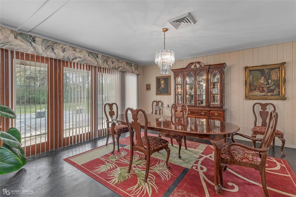 701 Palmetto Road Benton, LA 71006 - Photo 5 of 28 a view of a dining room with furniture window and wooden floor