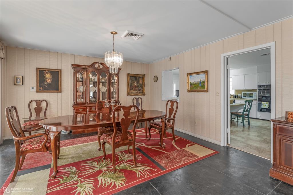 701 Palmetto Road Benton, LA 71006 - Photo 6 of 28 a view of a dining room with furniture and wooden floor