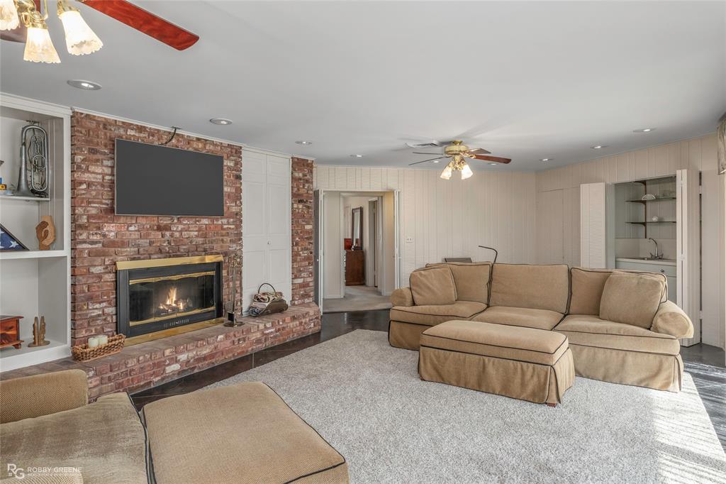 701 Palmetto Road Benton, LA 71006 - Photo 7 of 28 a living room with furniture and a fireplace