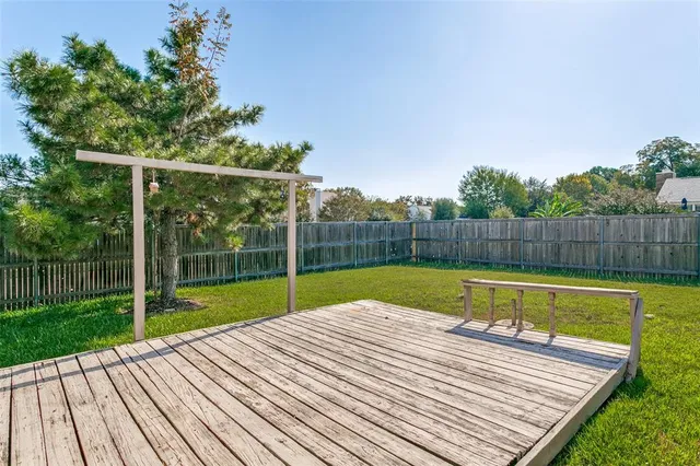 a view of a backyard with a small pool