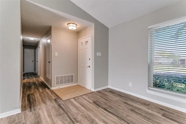 a view of livingroom with hardwood floor and a ceiling fan