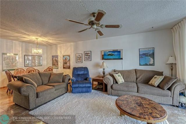 a living room with couches a table and a couch