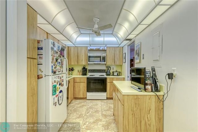 a kitchen with cabinets and appliances