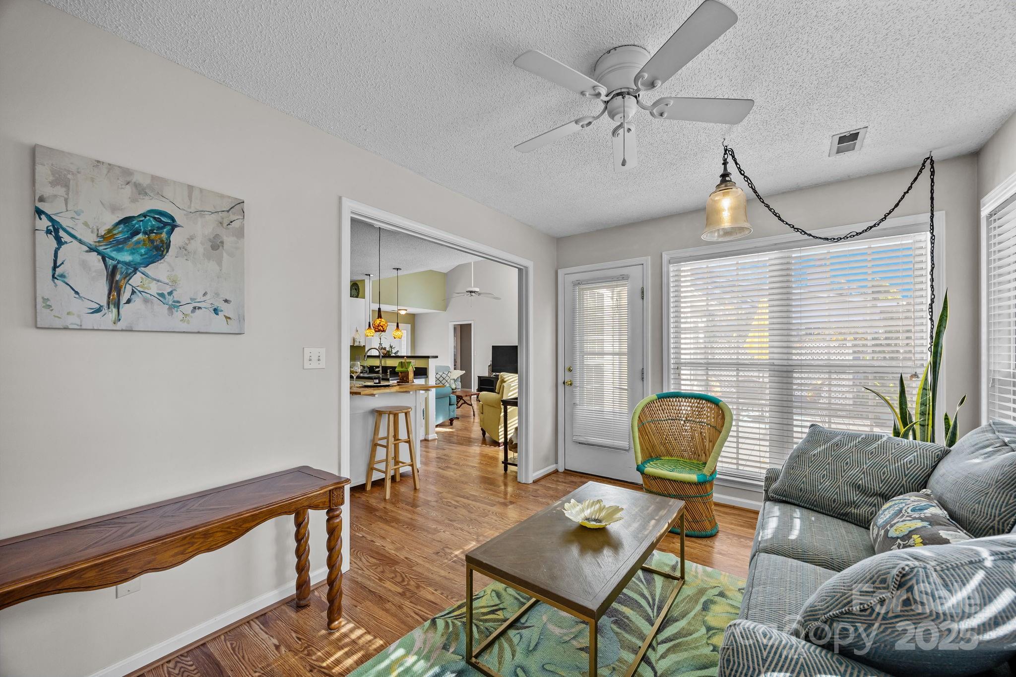 255 Stonehollow Road Fletcher, NC 28732 - Photo 12 of 32 a living room with furniture a couch and a chandelier