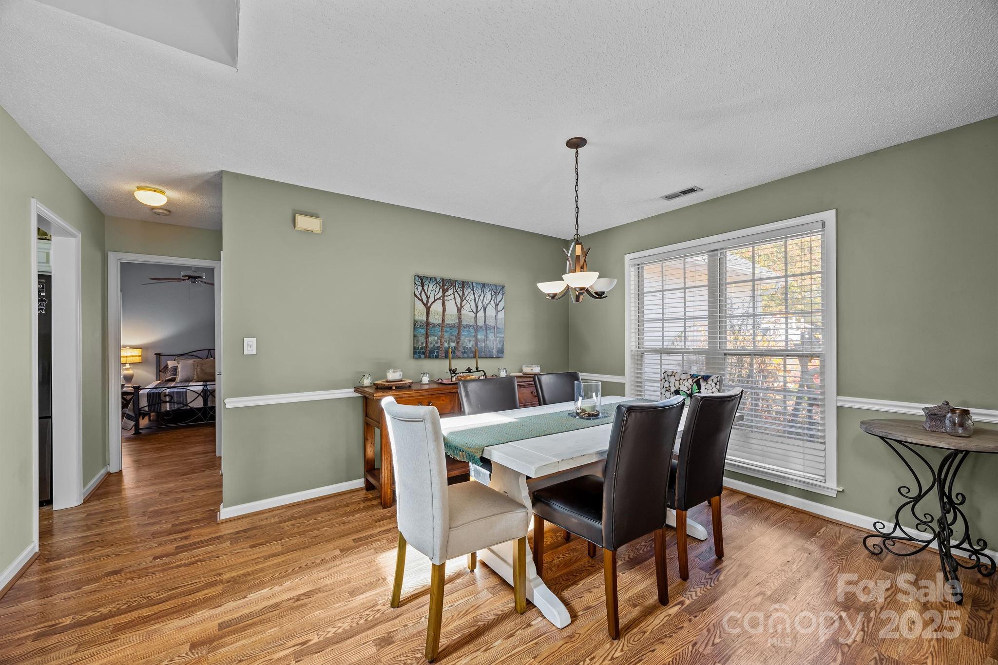 255 Stonehollow Road Fletcher, NC 28732 - Photo 14 of 32 a view of a dining room with furniture window and wooden floor