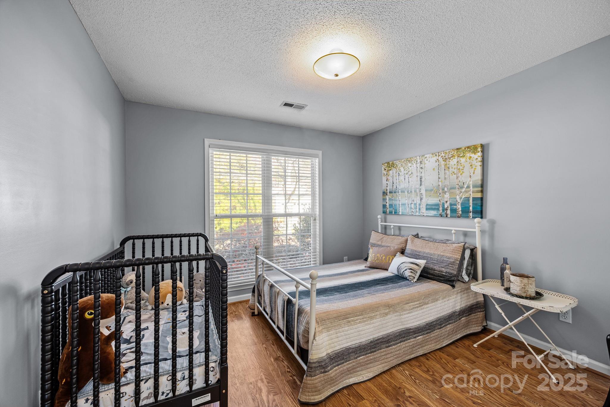 255 Stonehollow Road Fletcher, NC 28732 - Photo 21 of 32 a bedroom with a bed and window