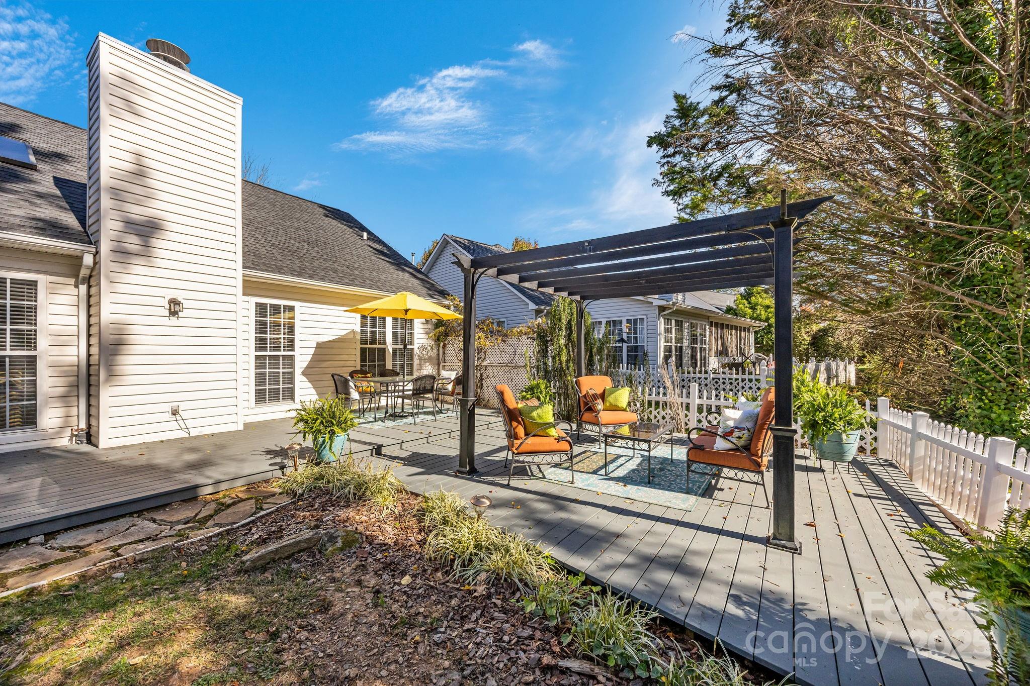 255 Stonehollow Road Fletcher, NC 28732 - Photo 30 of 32 a view of a house with backyard and sitting area