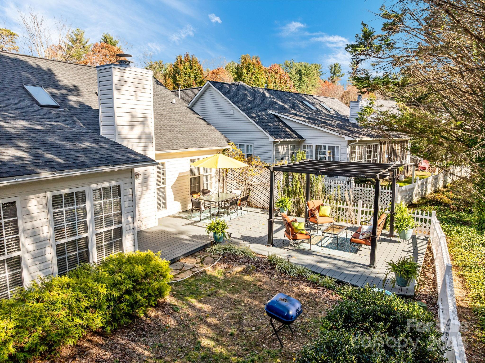 255 Stonehollow Road Fletcher, NC 28732 - Photo 3 of 32 a view of a backyard with plants and lounge chair