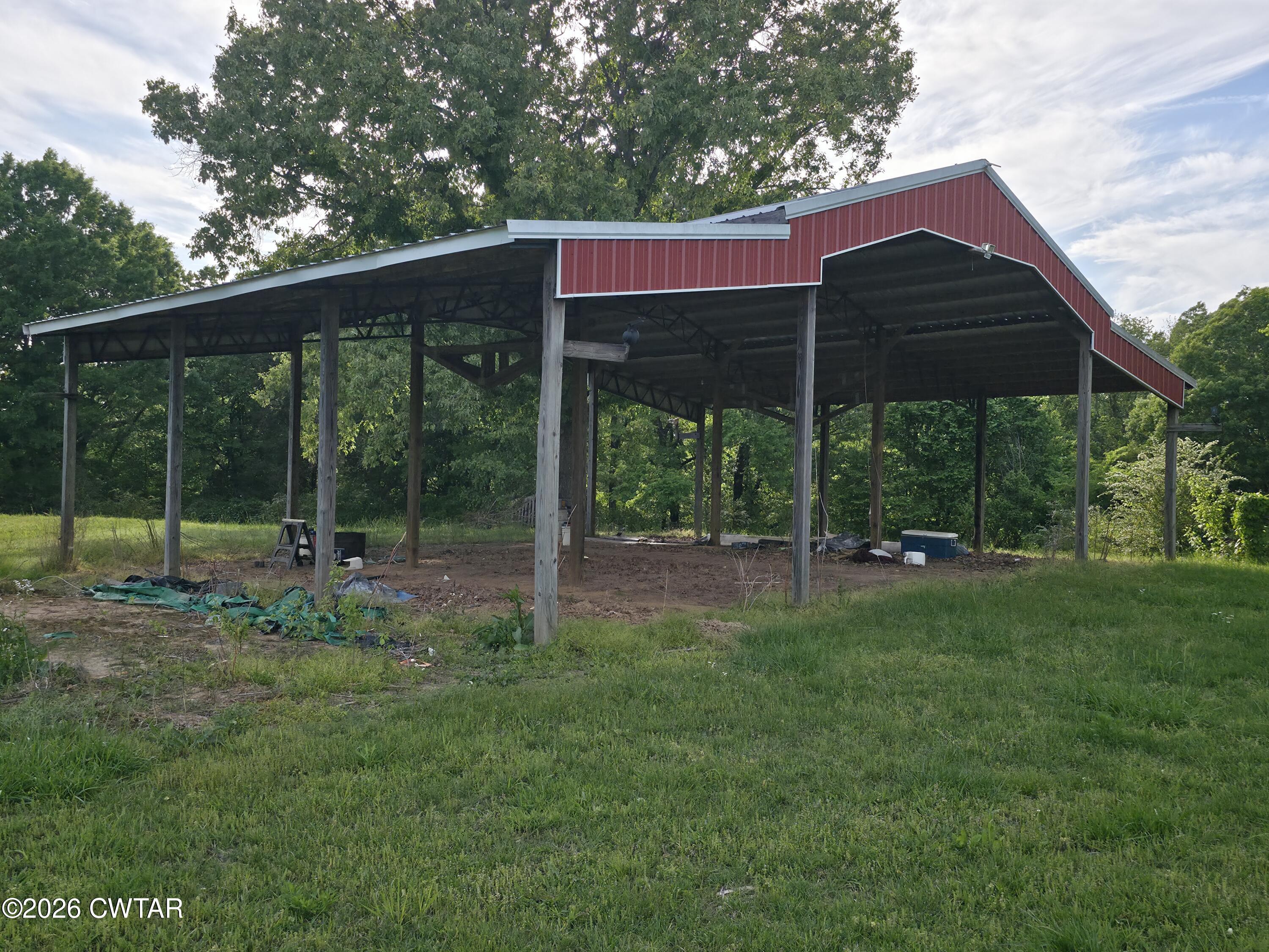 111 Leighton County Line Road Denmark, TN 38391 - Photo 14 of 53 a view of a house with backyard and a backyard